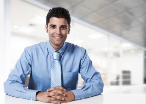 Young successful business man at office