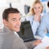 Couple with real-estate agent in office