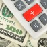 dollars and calculator with plus red button