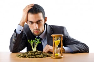 Businessman with gold seedlings and coins